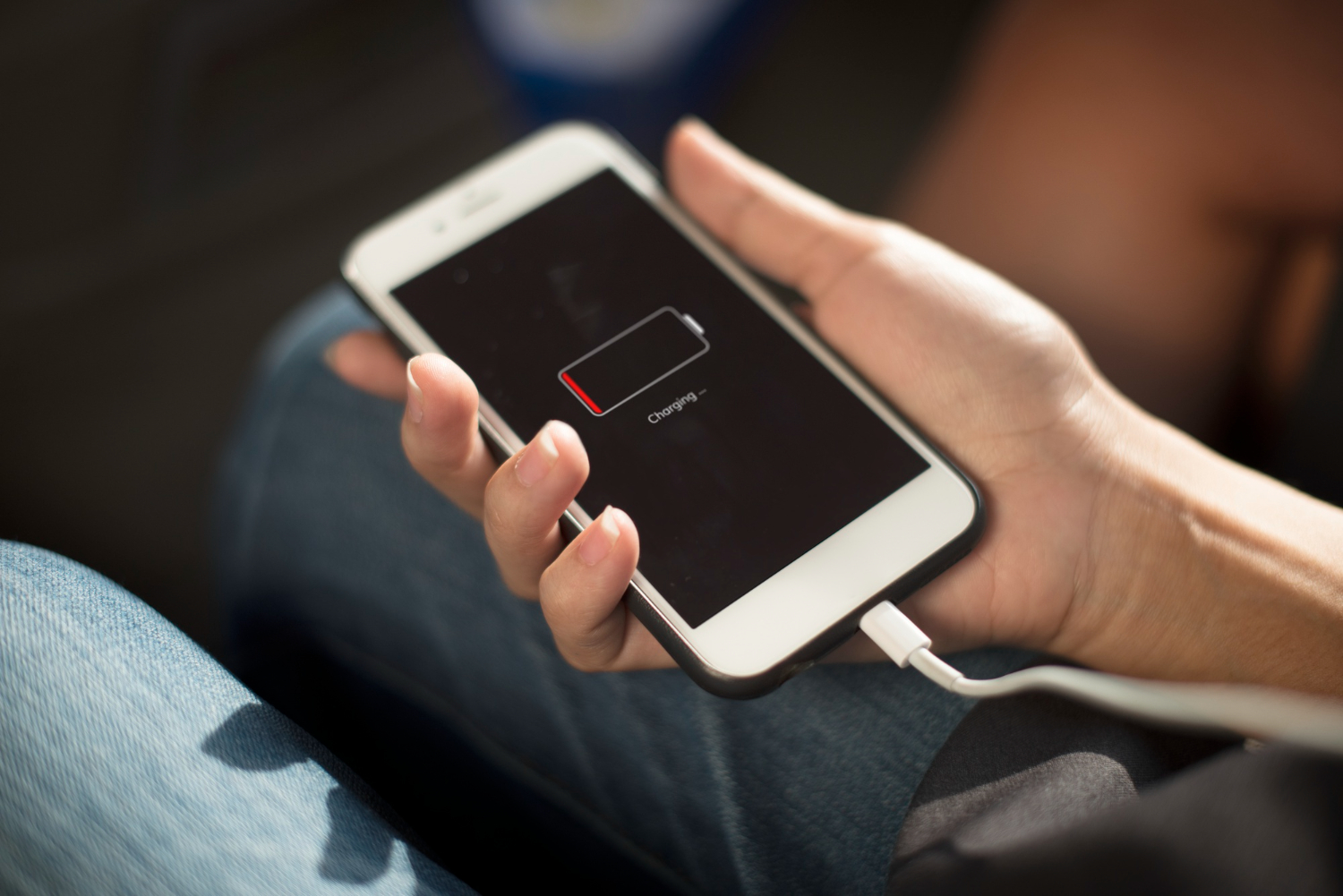 man charging phone